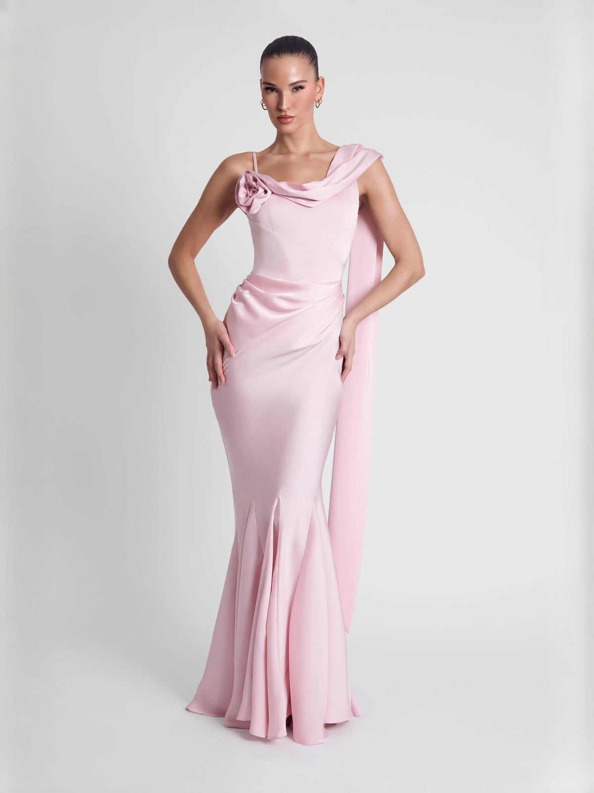 Pink fitted mermaid floor-length dress with off-shoulder drape and rosette at neckline