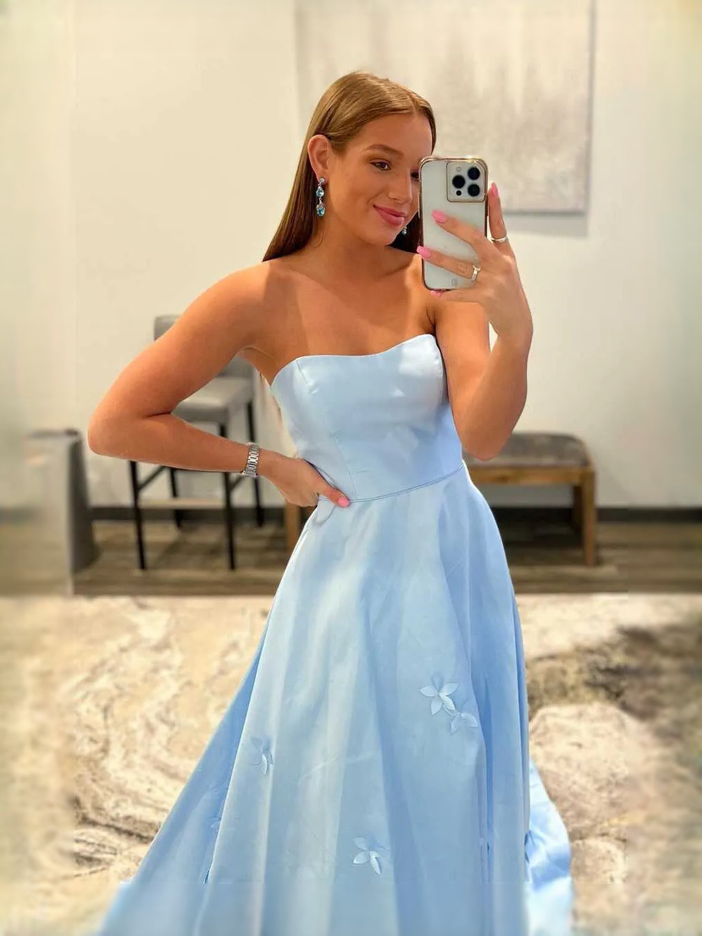 Sky blue strapless corset prom dress with sweetheart neckline and small floral appliques