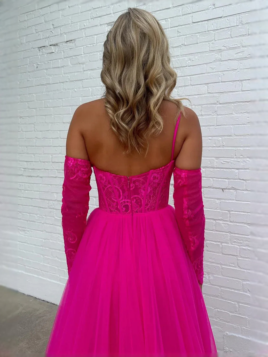 Hot pink backless corset ball gown with lace long sleeves and layered tulle skirt