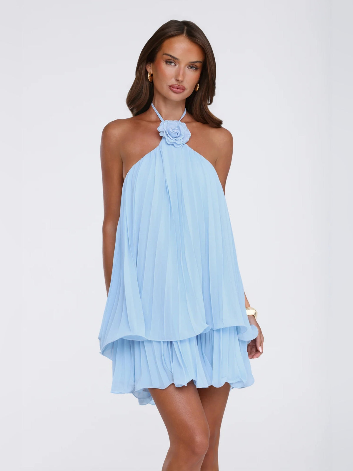 Light blue pleated halter mini dress with rosette neckline and layered ruffle hem