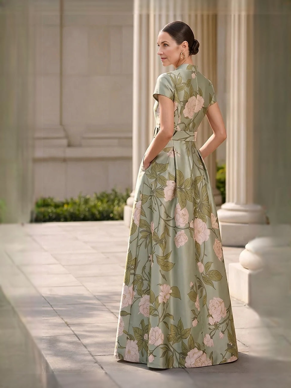 Green floral pleated satin A-line maxi dress with high neck and short sleeves, side view