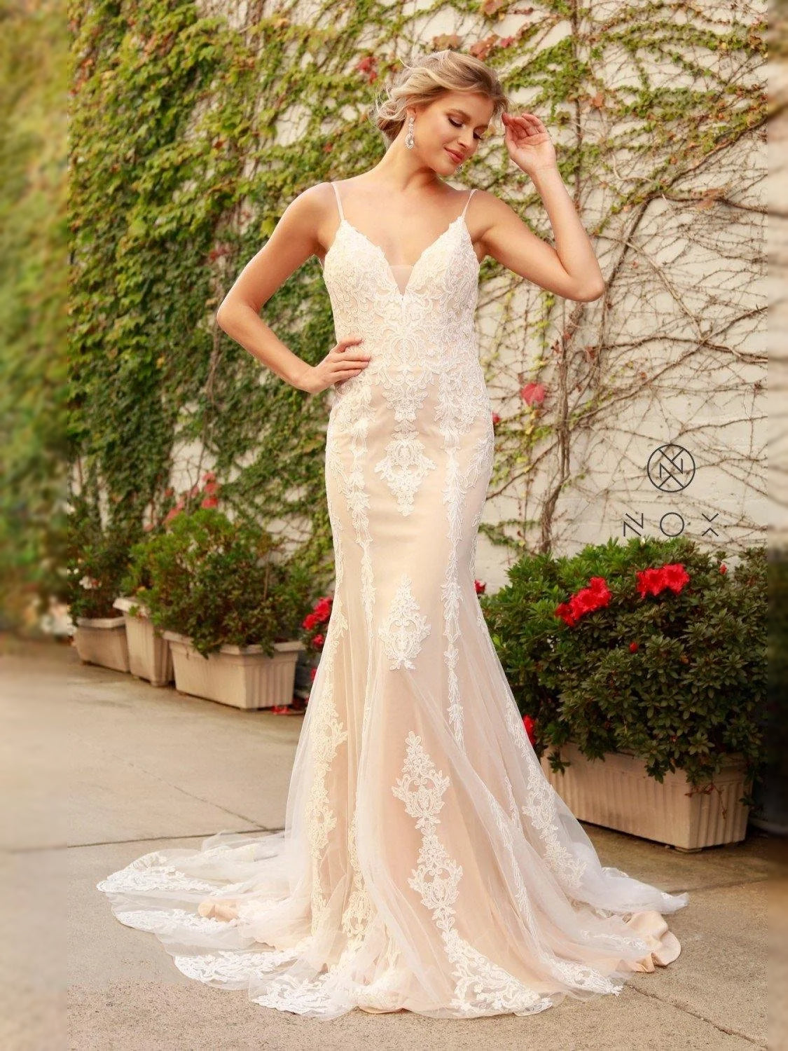 Ivory V-neck mermaid wedding dress with lace appliques and flowing tulle skirt