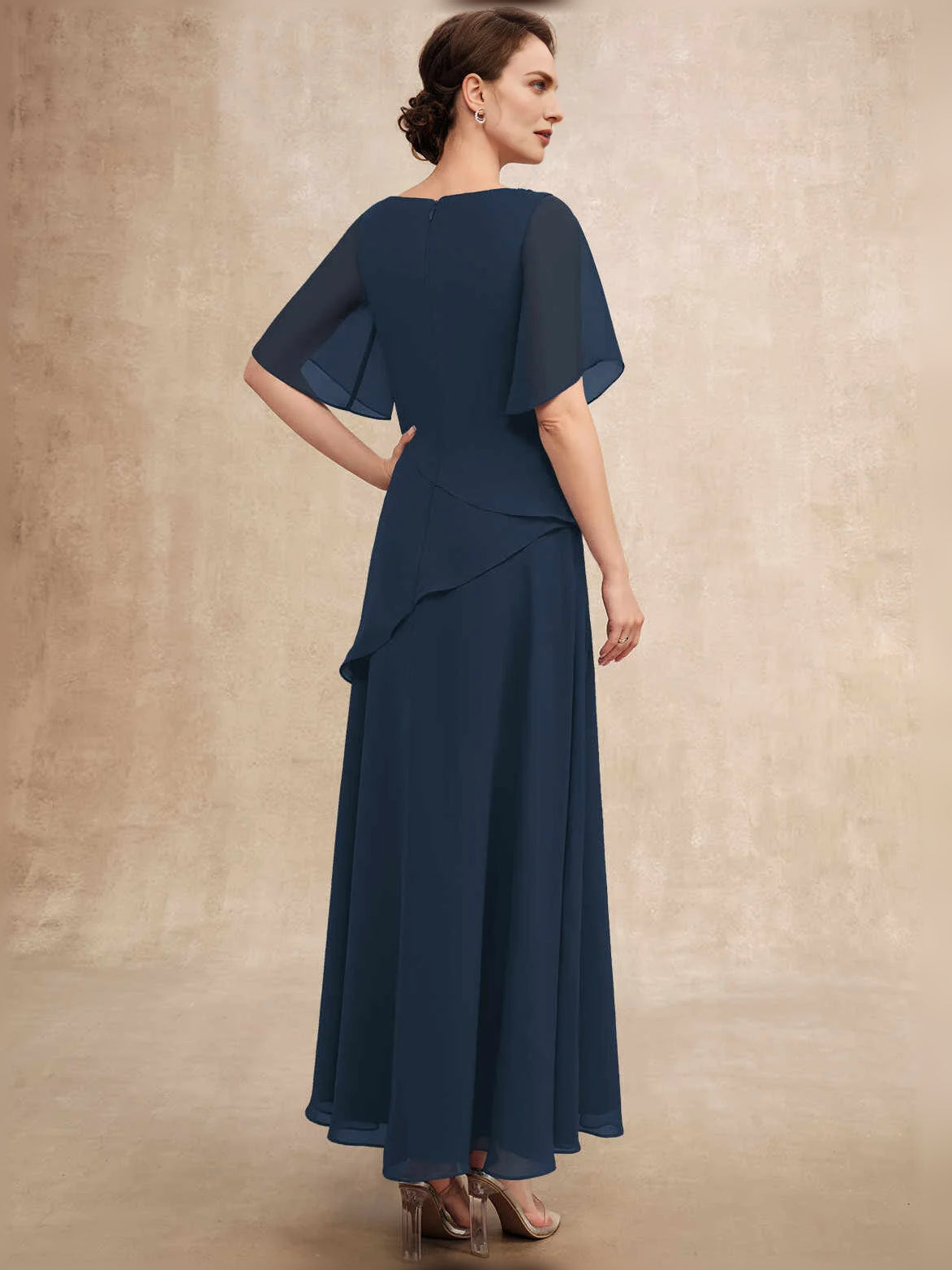 Dark navy chiffon mother-of-the-bride dress with beaded boat neckline and layered front