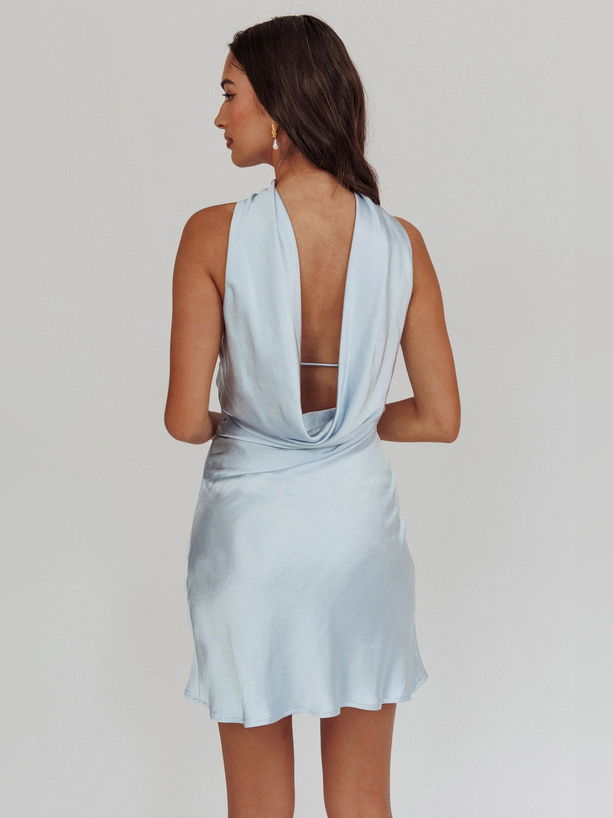 Light blue halter-neck mini dress with open back and draped halter strap
