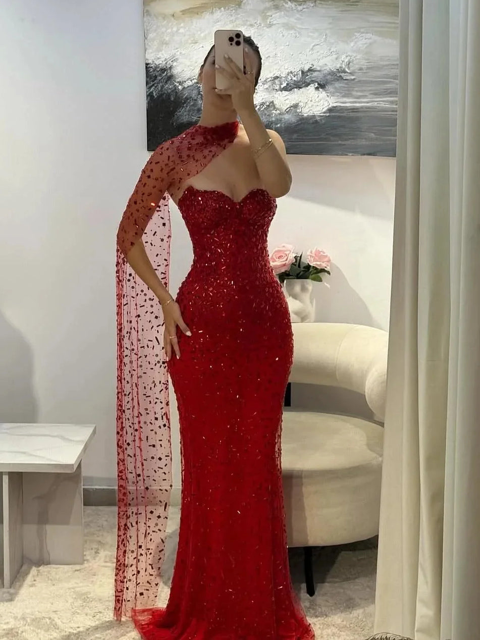 Red sequin sweetheart mermaid prom dress with long sheer side drape, floor-length