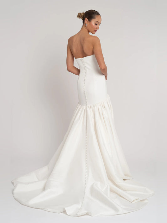 Ivory strapless A-line formal dress with open back and pleated floor-length skirt