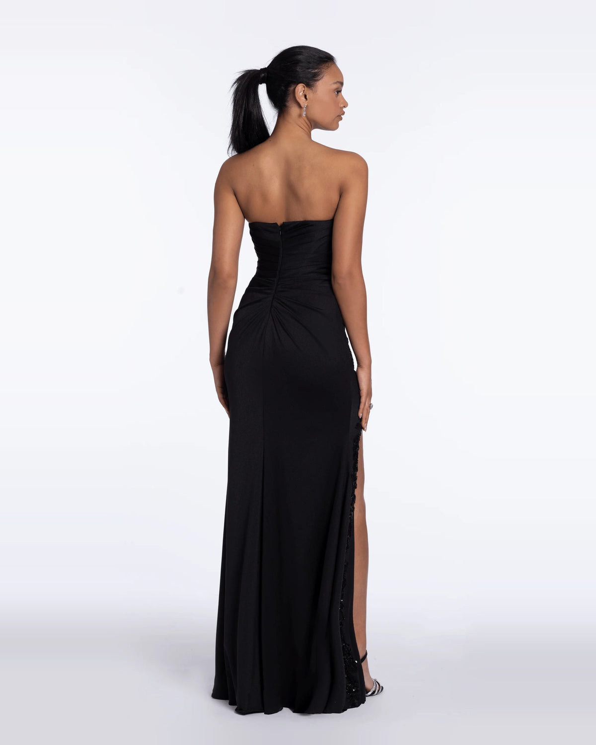 Black strapless sweetheart column maxi evening dress, back view with draped ruched bodice