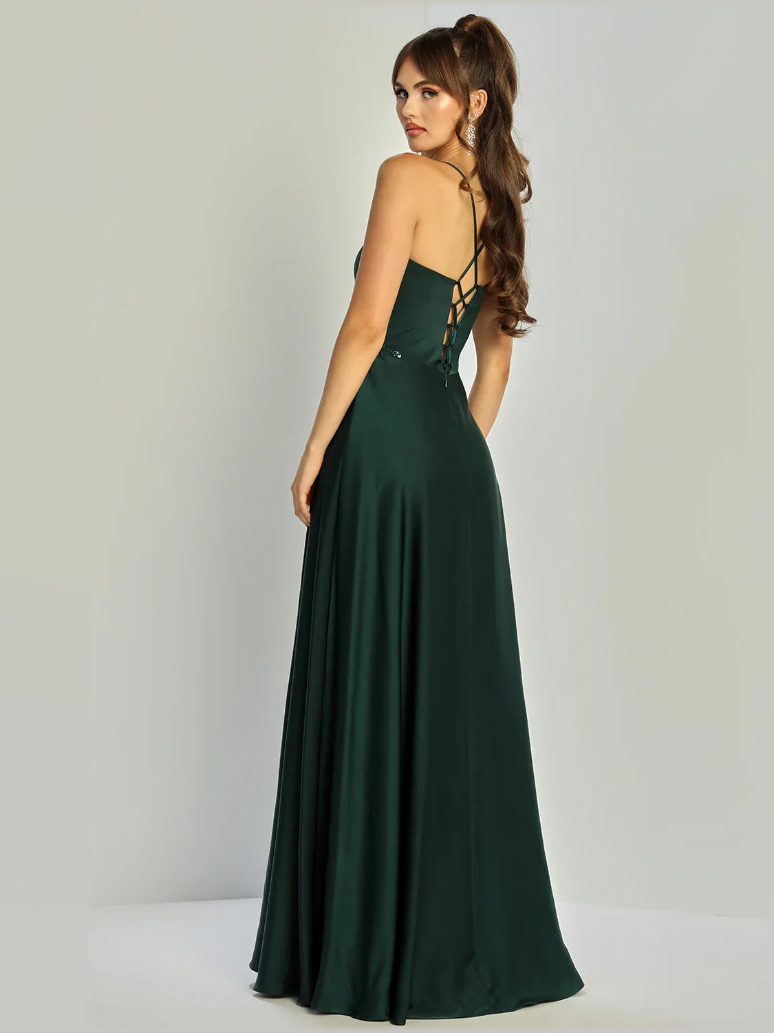 Dark green formal dress with crisscross back spaghetti straps and beaded waist full skirt