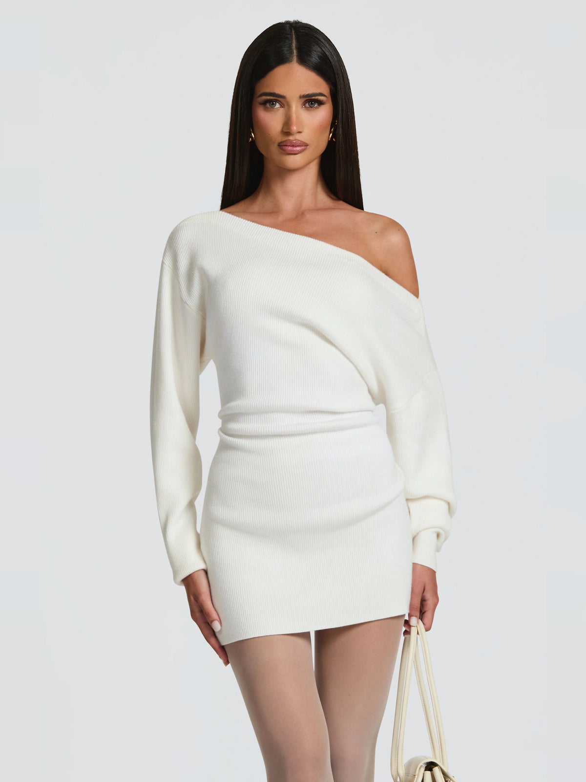 Ivory off-shoulder mini dress with one-shoulder look, long sleeves, fitted waist