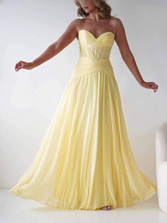 Yellow sweetheart A-line chiffon prom dress with corset bodice and flowing floor-length skirt