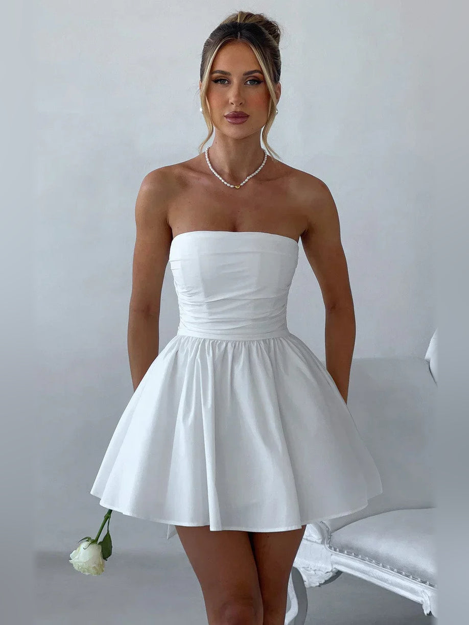 White strapless mini A-line dress with ruched bodice and softly gathered skirt.