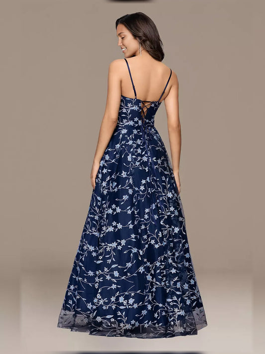 Back view navy floral print formal dress with thin straps and tiered skirt