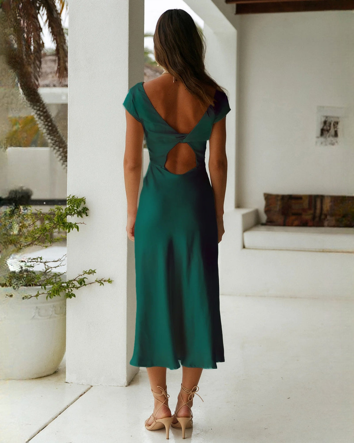 Emerald green satin sleeveless A-line bridesmaid dress with open back cutout