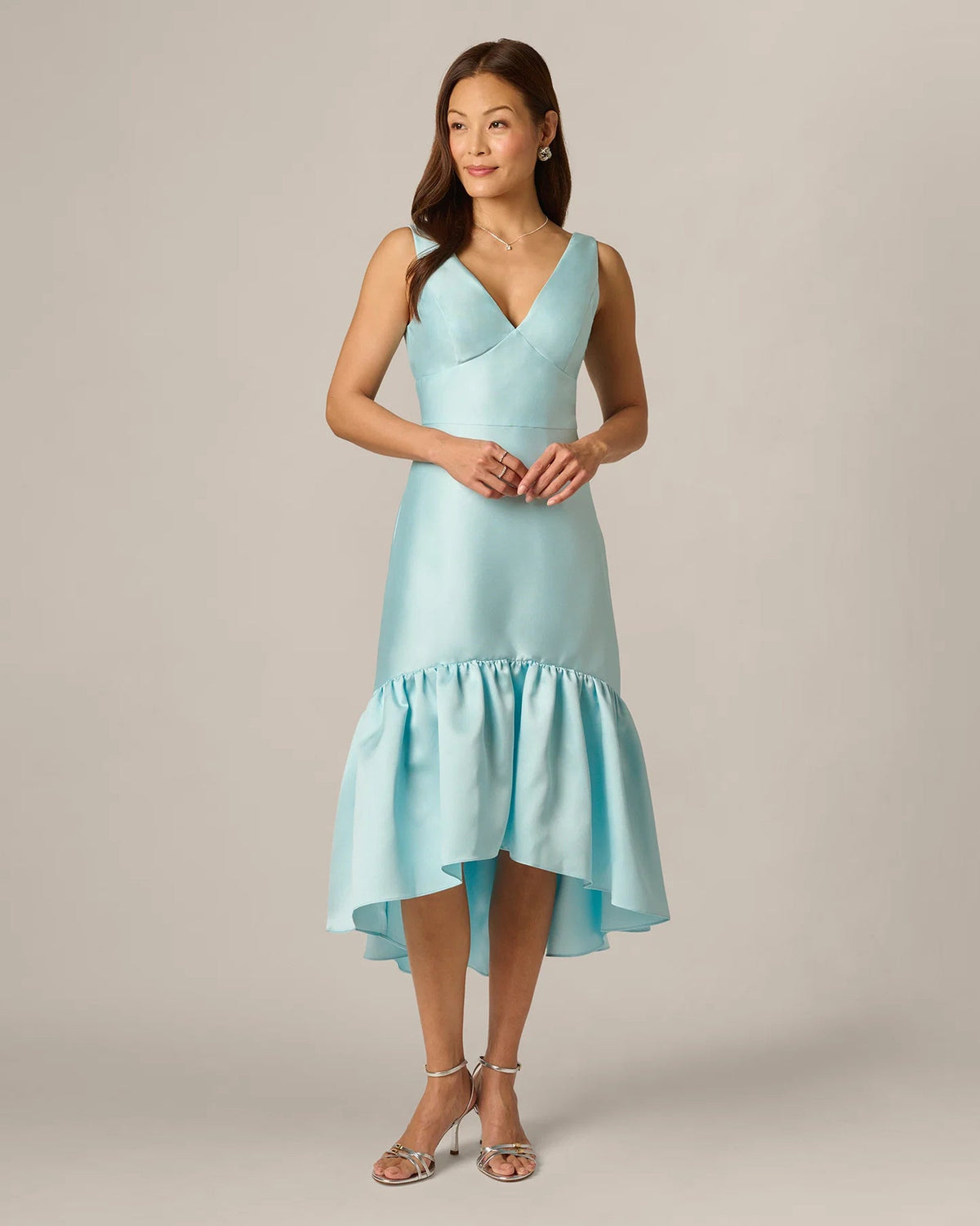 Pale aqua sleeveless V-neck midi dress with gathered ruffle hem, front view