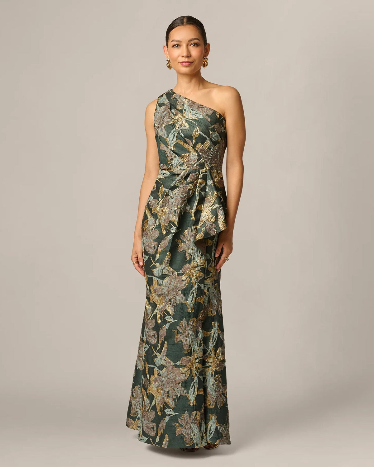 One-shoulder A-line maxi gown with dark green and gold botanical pattern