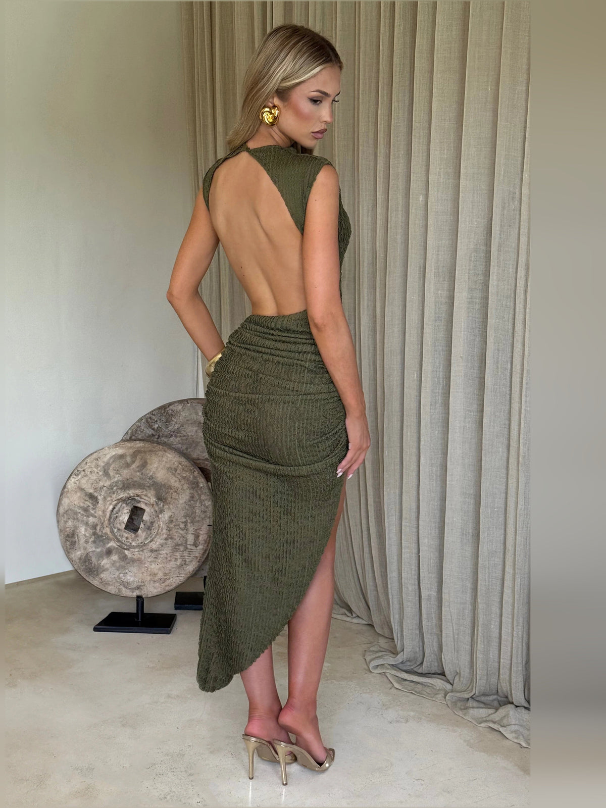 Khaki backless midi formal dress with sleeveless high neck and ruched bodycon silhouette.