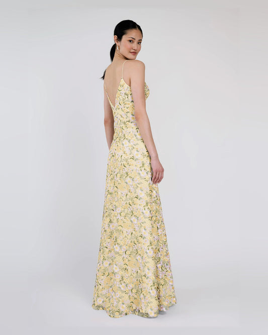 Yellow A-line maxi dress with spaghetti straps and sweetheart neckline, floral print side view