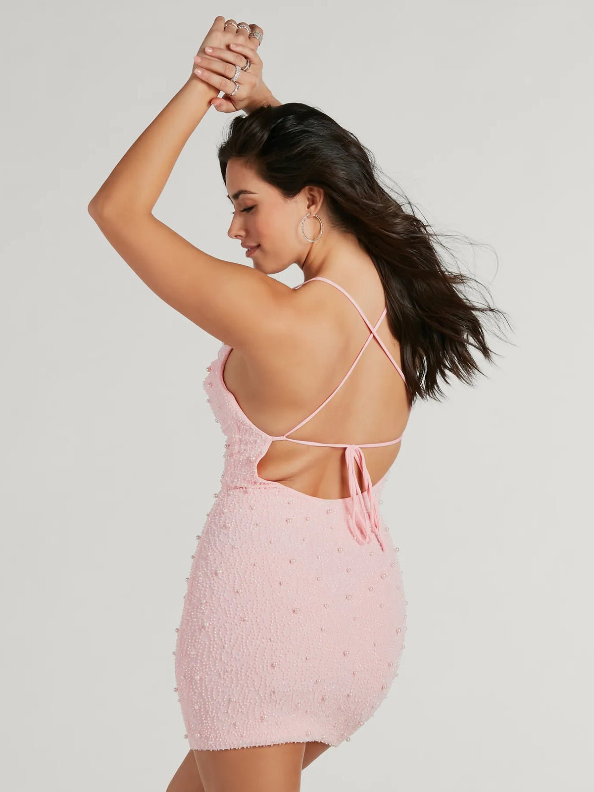 Pink sequin mini dress with open back and crisscross spaghetti straps