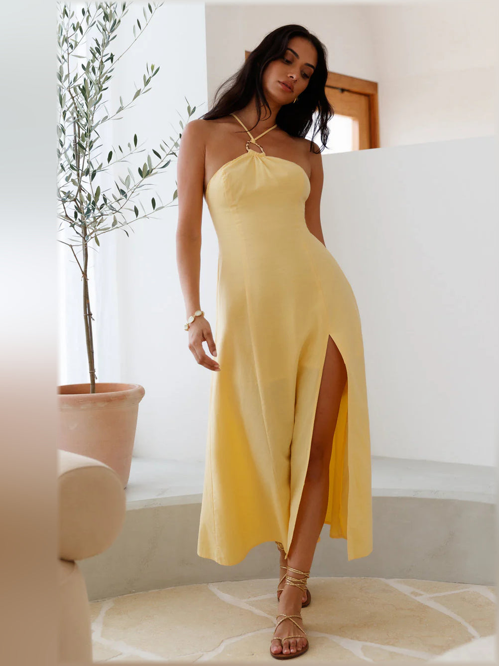 Yellow halter midi dress with side slit and draped bodice, thin straps