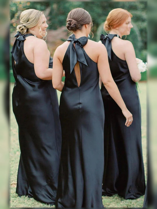 Backless black halter satin floor-length dress with ribbon ties at neck