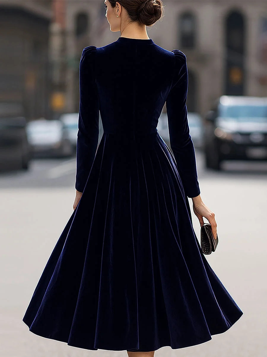 Navy blue velvet A-line midi dress, open-back style with long sleeves