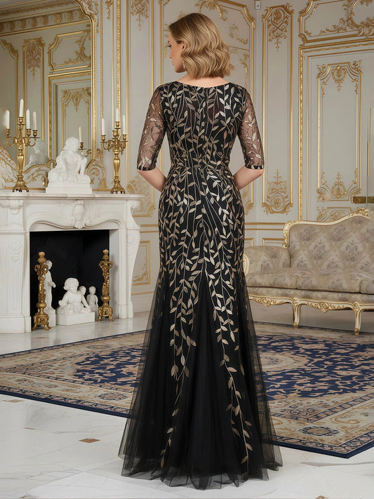 Black embroidered mermaid gown back view with V-neck illusion and sheer sleeves