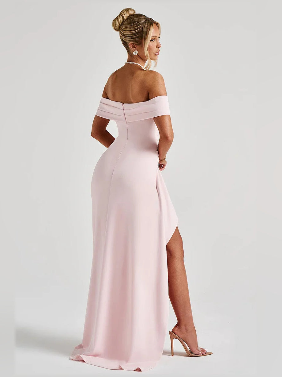 Blush pink off-shoulder formal gown with ruched waist and side thigh-high slit.