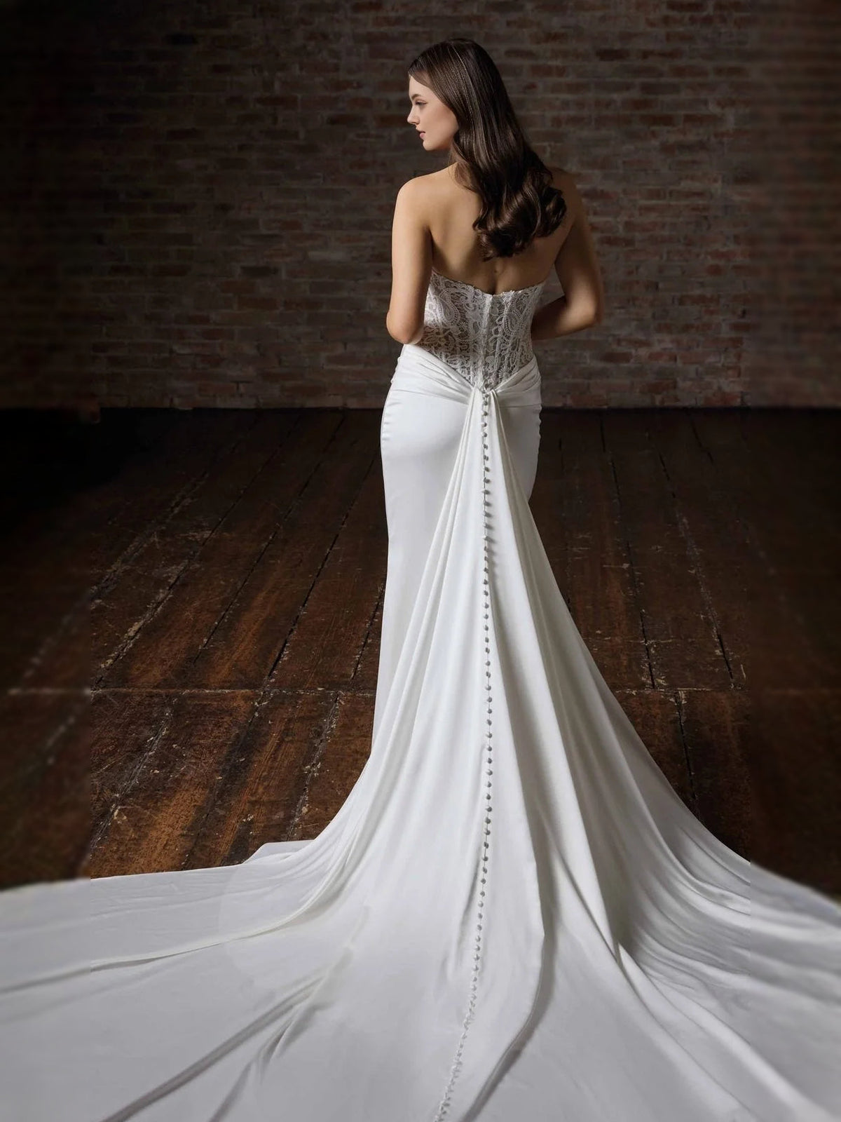 White satin mermaid wedding dress with lace corset bodice and draped ruching at waist