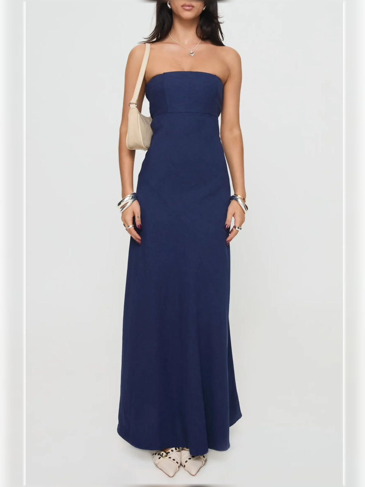 Navy strapless cutout sheath formal dress, floor-length, angled front view
