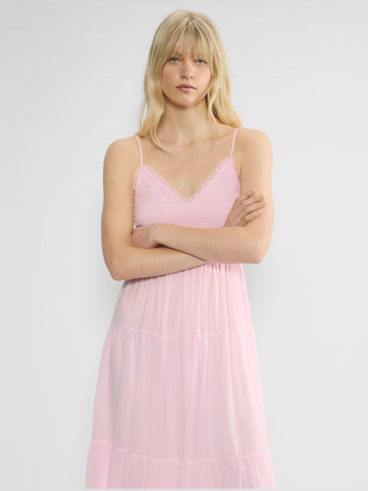 Pink chiffon V-neck midi dress with spaghetti straps and tiered skirt