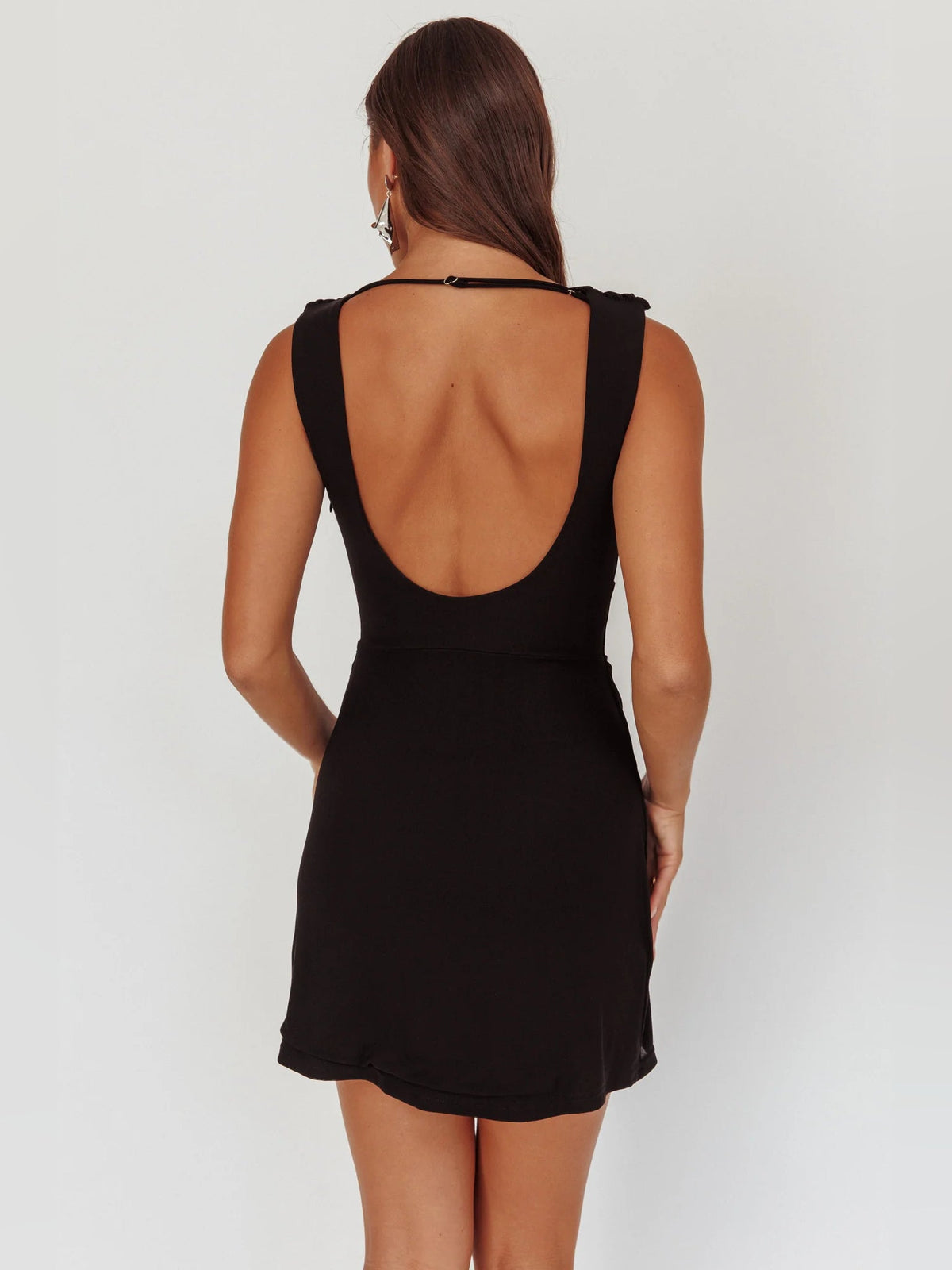 Black draped mini dress with open back and halter-style straps