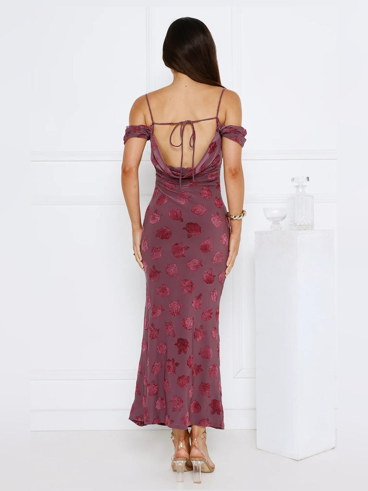 Back view of off-shoulder maxi dress with maroon floral print and lace-up straps