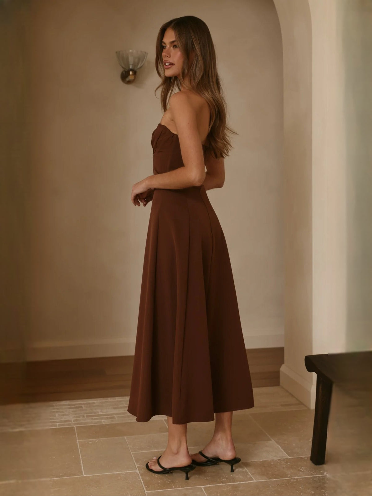 Chocolate strapless midi formal dress, sweetheart bodice with flared skirt, side view