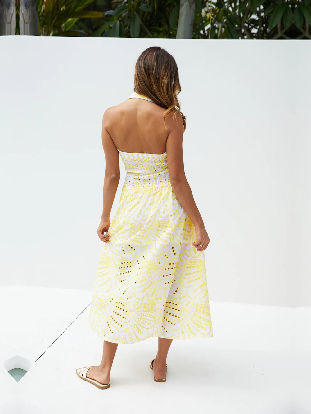 Yellow a-line maxi formal dress with printed pattern, full-length back view