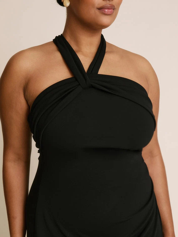 Black halter sheath dress with twisted halter neckline and ruched bodice