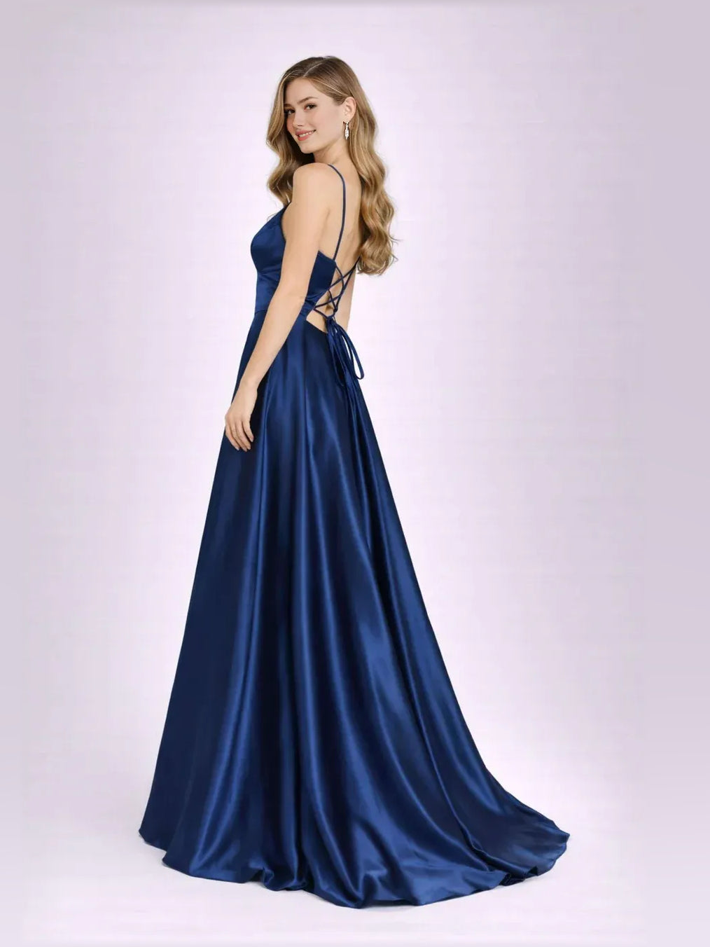 Navy blue open-back A-line formal gown with crisscross straps, sleeveless