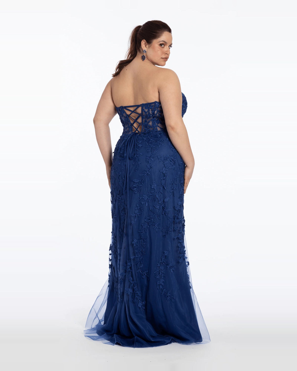 Navy strapless corset maxi prom dress with lace-up back and embroidered column skirt.