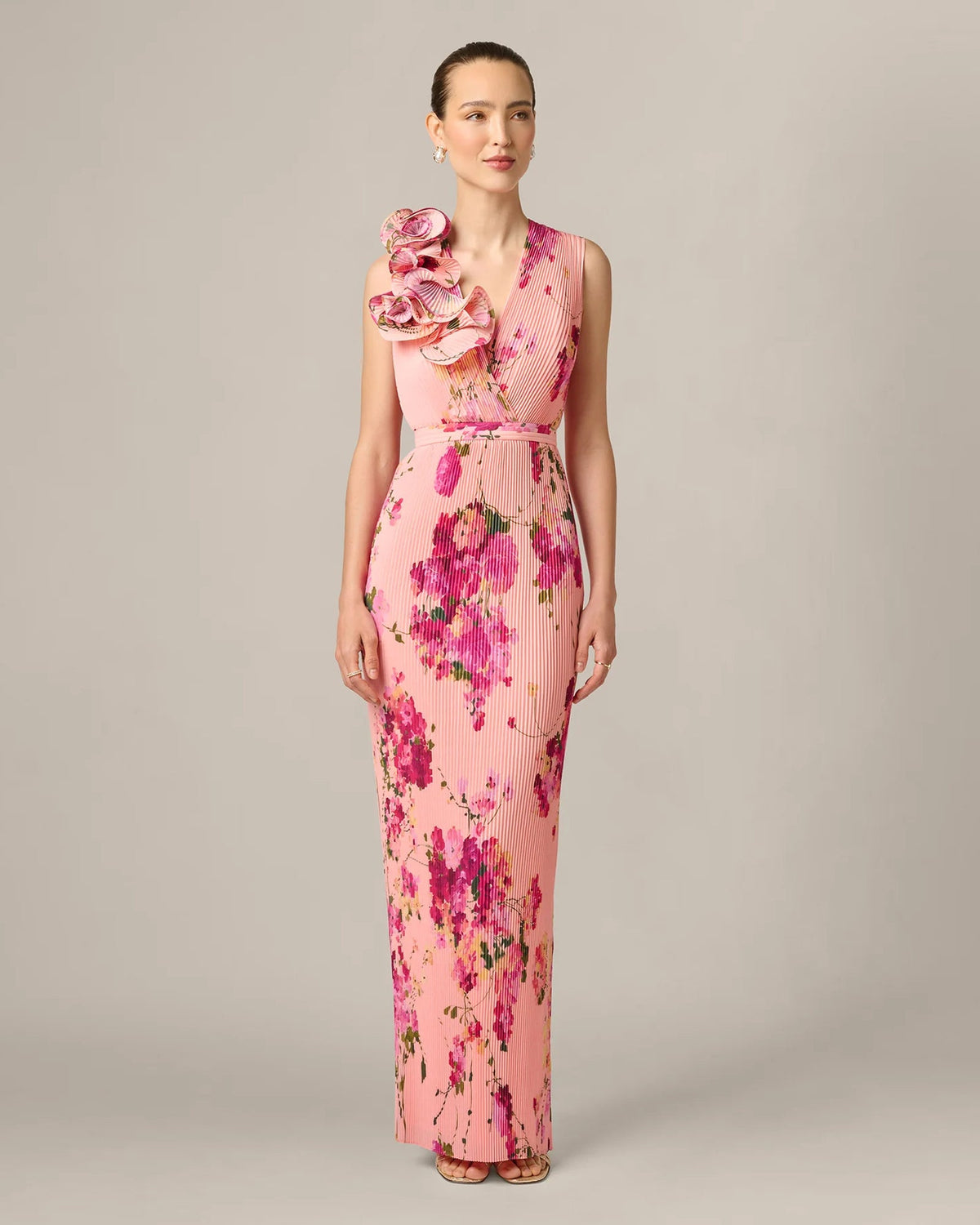 Pink floral sleeveless maxi dress with V-neck, fitted waist and layered shoulder ruffle