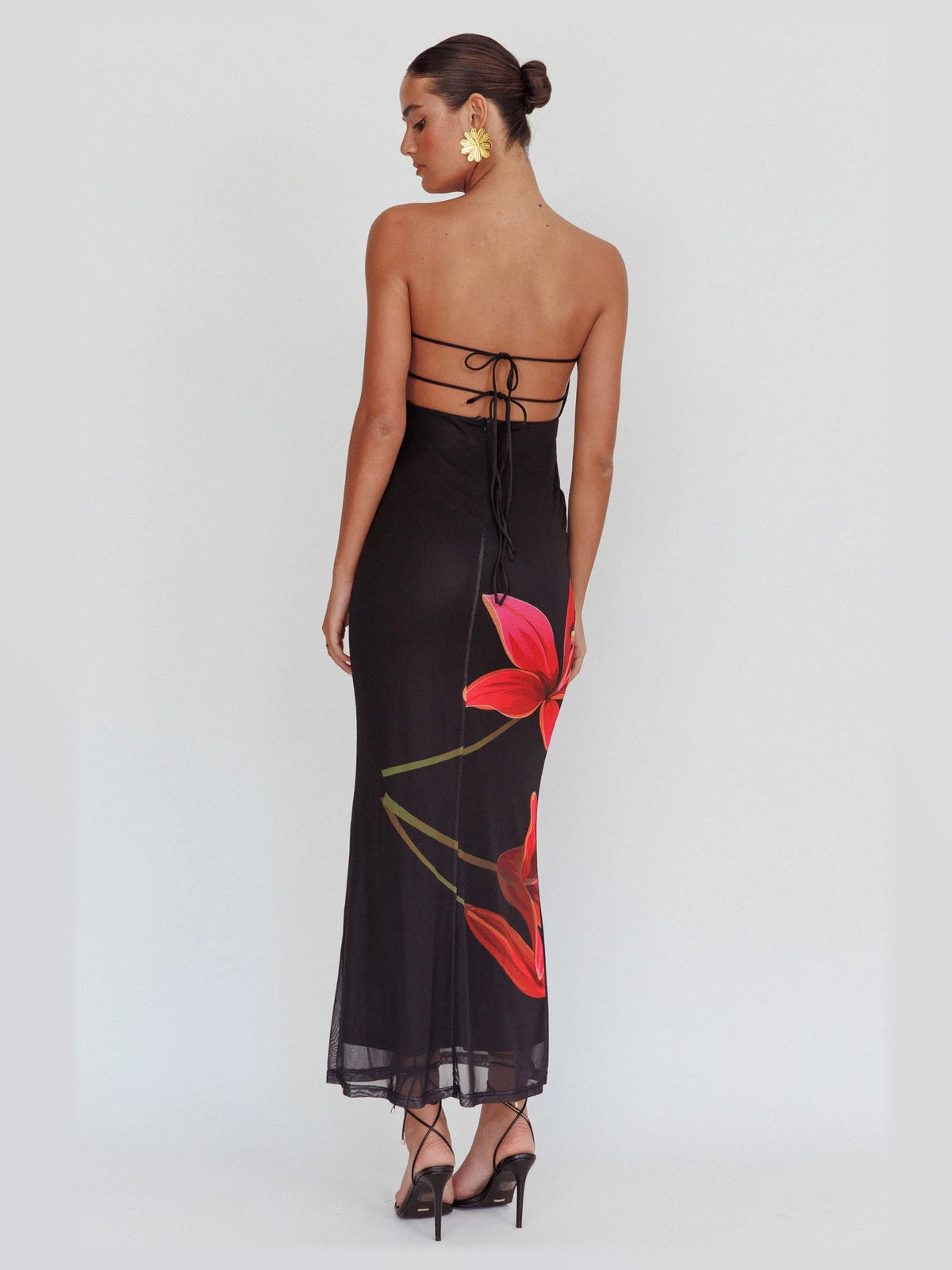 Black maxi formal dress, back full-length view showing the bodice