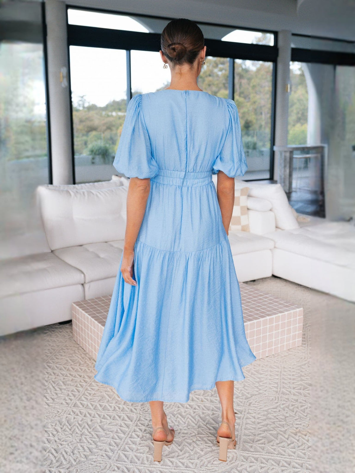Blue midi formal dress, back view with gathered waist and tiered skirt