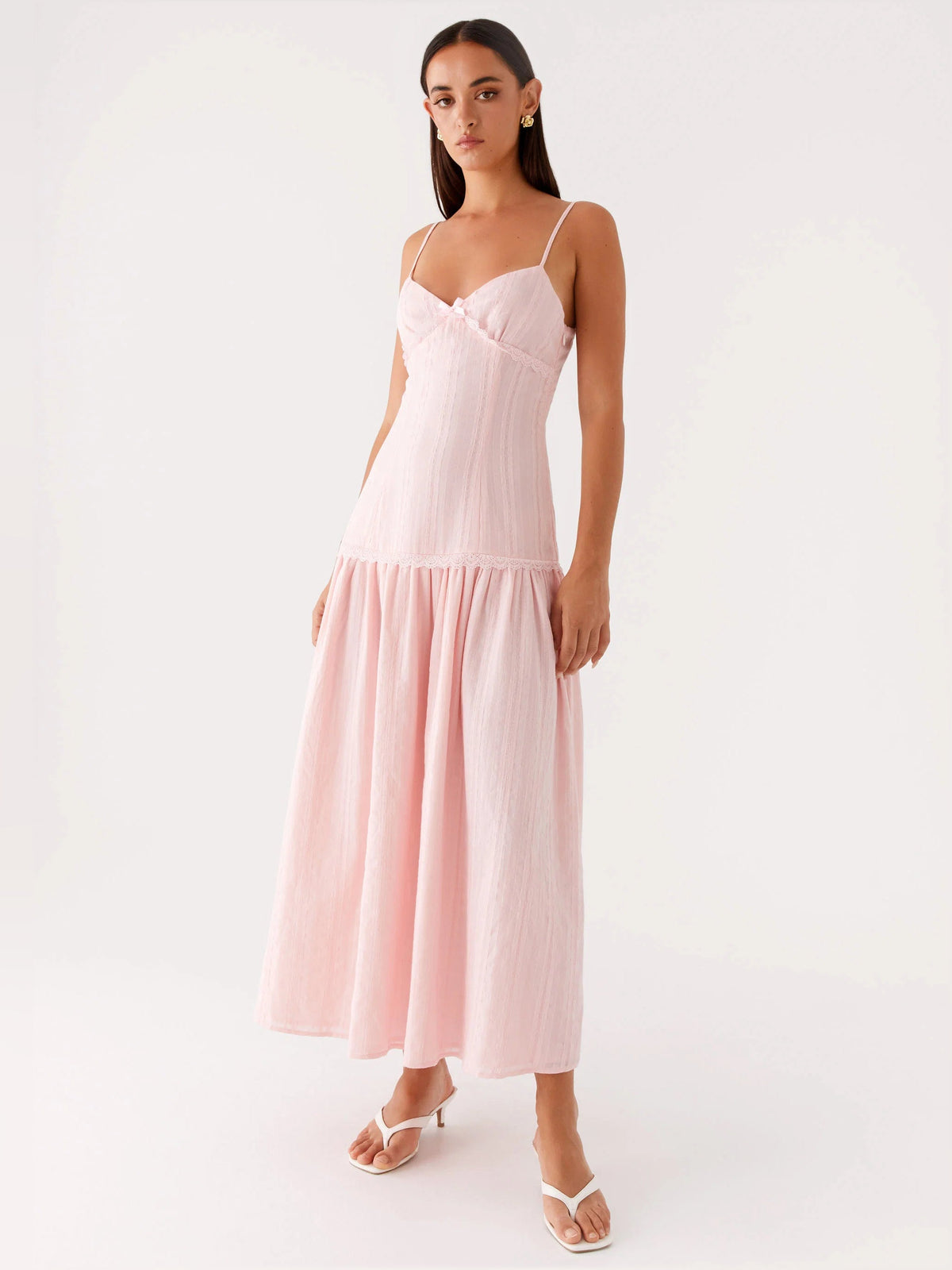 Pink midi formal dress with spaghetti straps and flowing tiered midi skirt