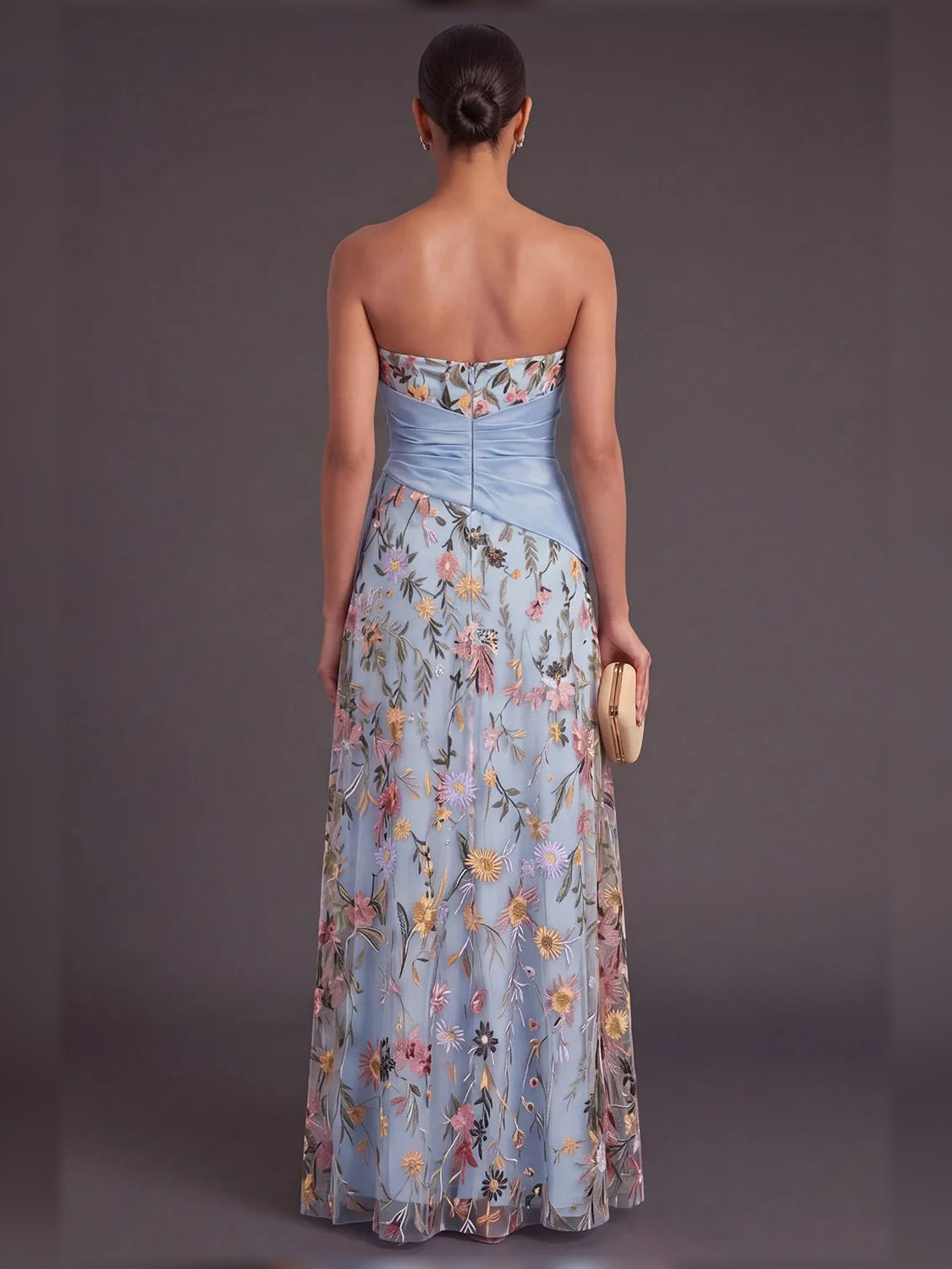 Back view of blue floral floor-length dress with sweetheart neckline and ruffle drape