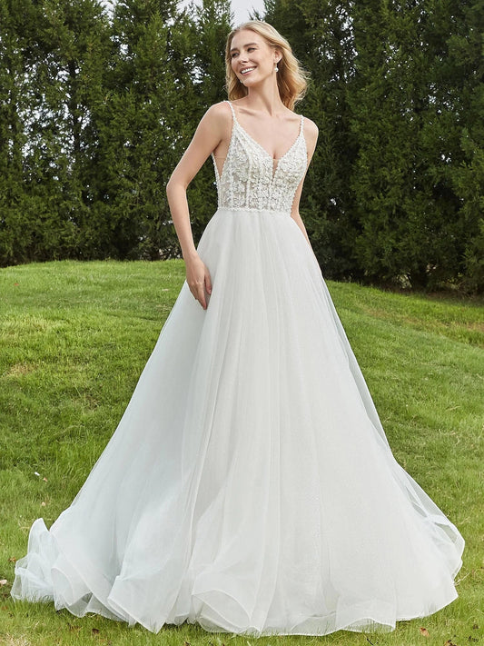 Ivory A-line tulle wedding dress with V-neck corset bodice and floral lace applique details.