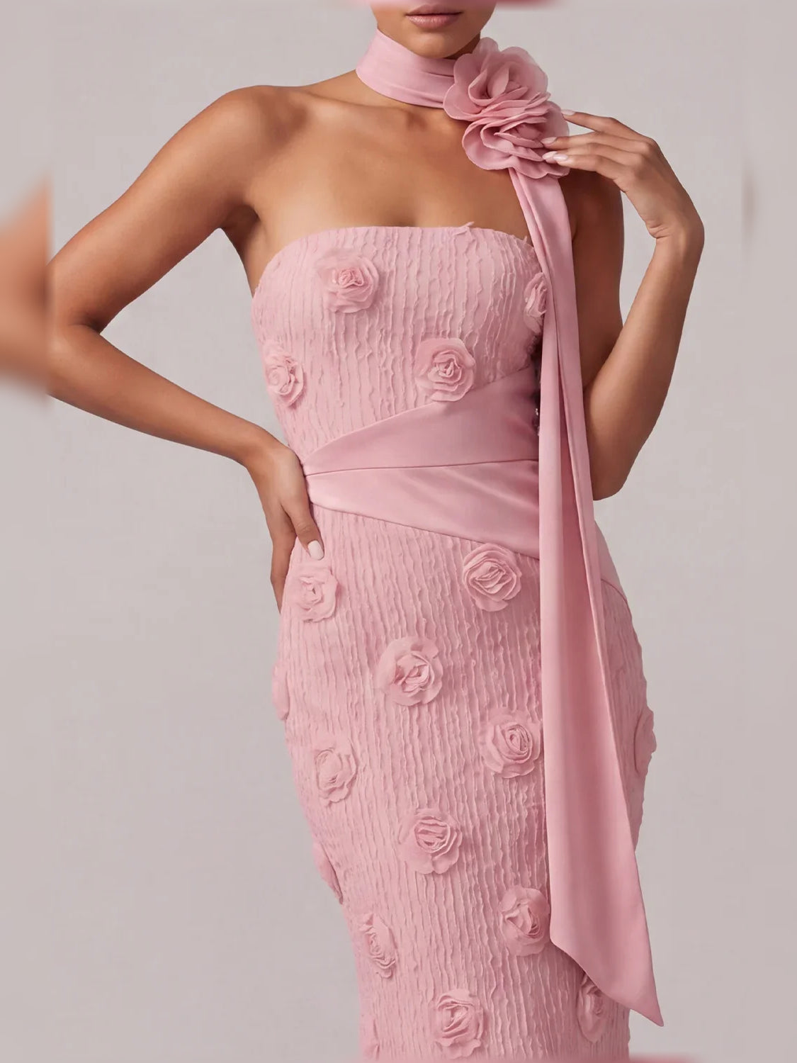 Light pink corset-style strapless bodice with rose applique texture and satin neck scarf