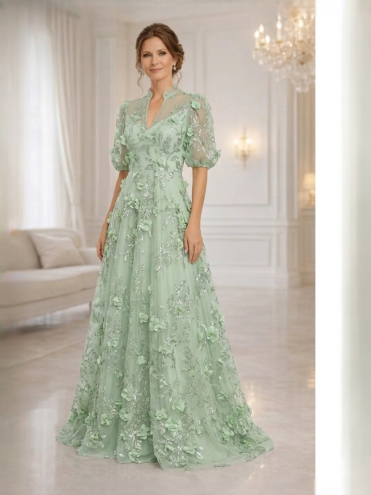 Mint green tulle A-line gown, high neck, short puff sleeves, layered floral detailing