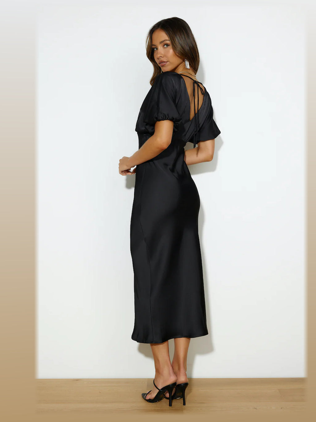 Black formal dress with satin construction and maxi hem