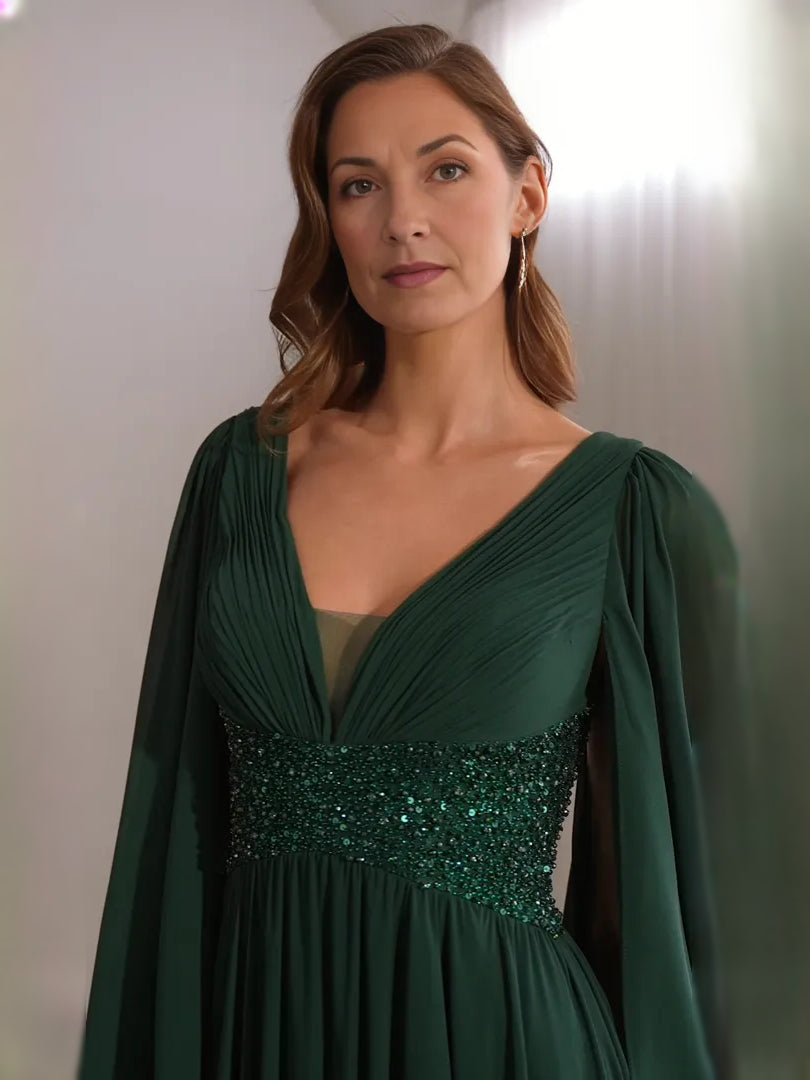 Dark green V-neck chiffon dress with beaded waistband and draped cape sleeves