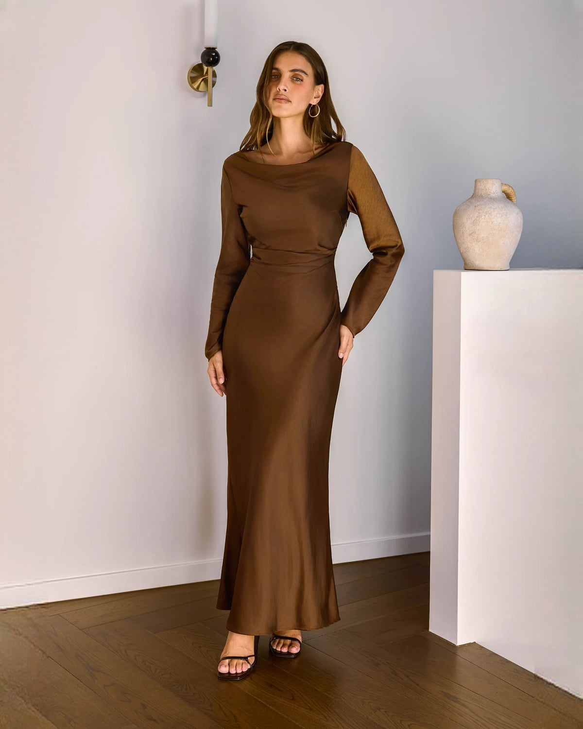 Chocolate brown satin long-sleeve maxi dress with draped cowl neckline and fitted waist