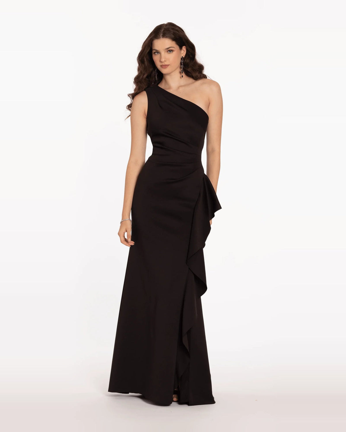 Black one-shoulder trumpet maxi dress with diagonal drape neckline and side ruffle