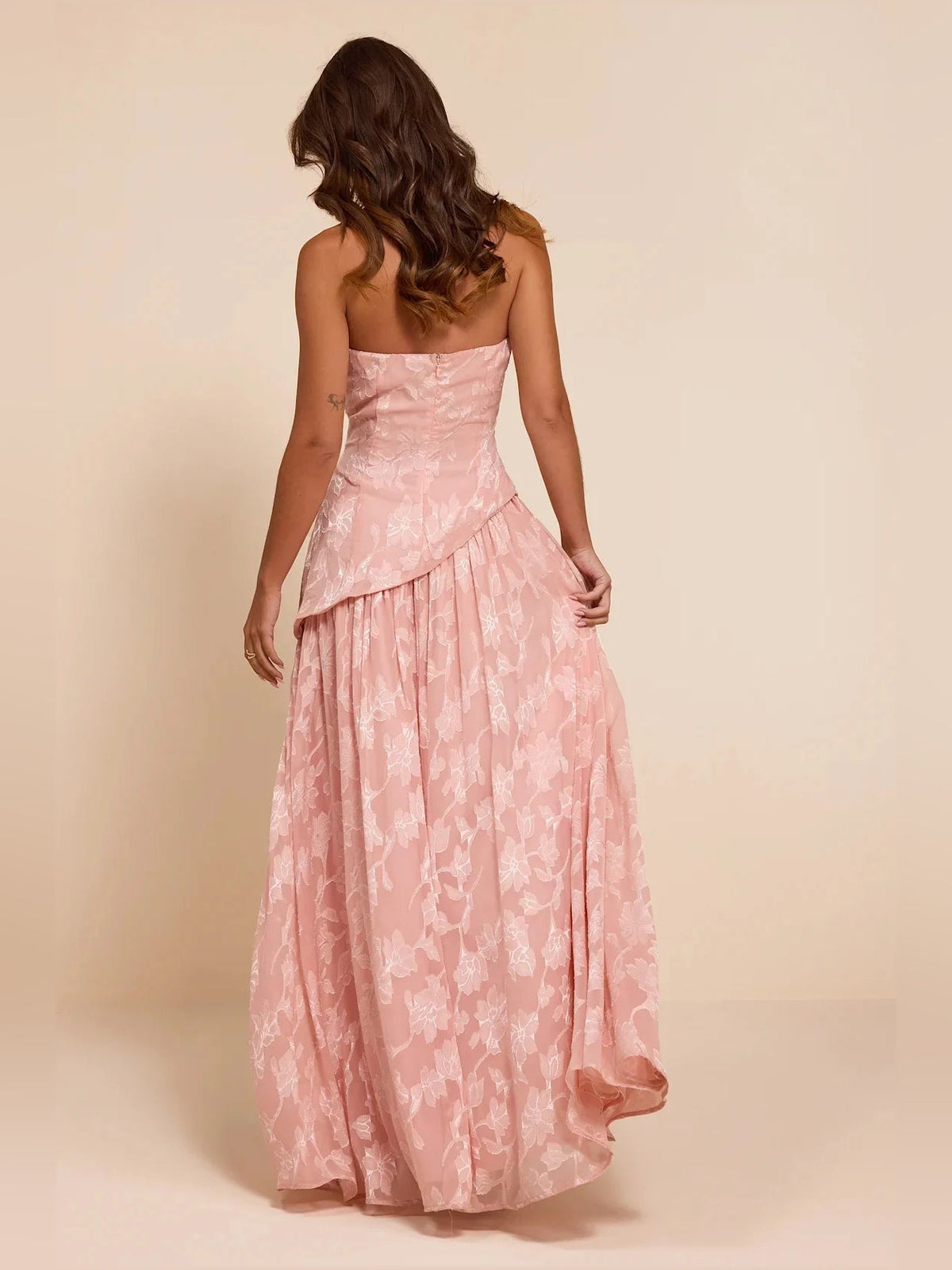 Dusty pink strapless maxi dress with allover floral pattern and back detail slit